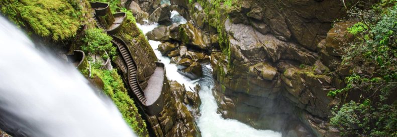 waterfall and stairs at pailon del diablo waterfall in baños ecuador