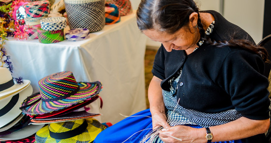 Woman making hat at traditional market in Cuenca, Ecuador