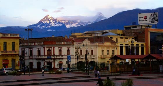 Colonial houses at Riobamba train station with Chimborazo volcano in background